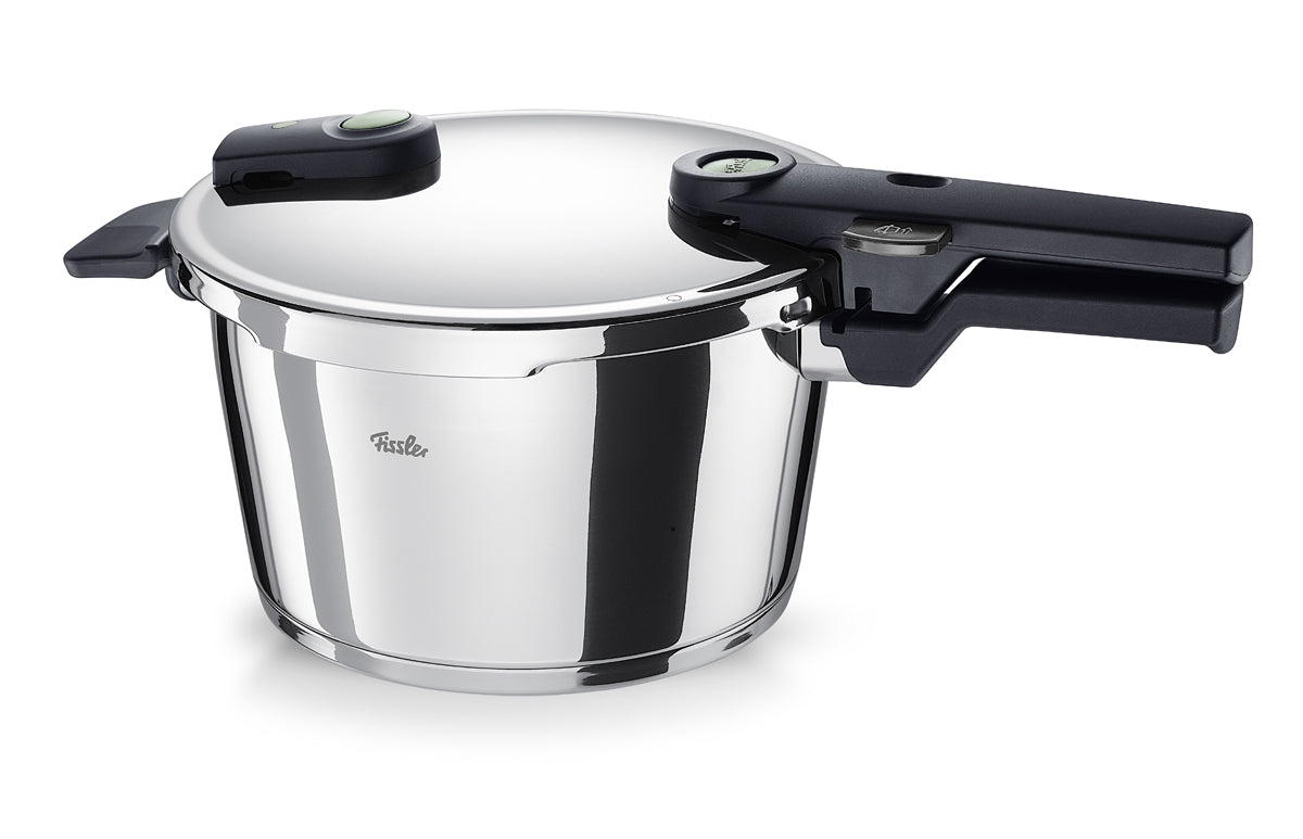 Fissler Vitaquick® Elemental sage green pressure cooker with black handle, German precision design, pictured on a white background.
