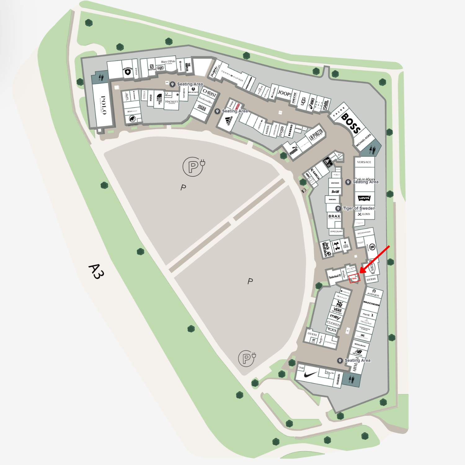 Detailed map of a building complex, clearly showing labeled rooms, pathways, parking zones, and green spaces with signature Fissler precision. A red arrow highlights a specific room in the lower right section—symbolizing the attention to detail and exacting standards found in every Fissler product, from stainless steel pots and pans to innovative pressure cookers and kitchen accessories.